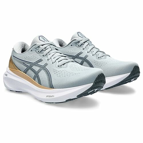 Pair of Asics Gel running shoes in light gray with white soles