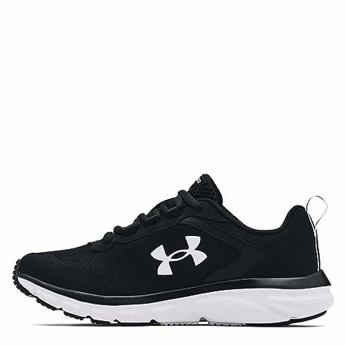 Black running shoe with white sole and Under Armour logo