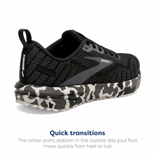 Black running shoe with camouflage-patterned sole.