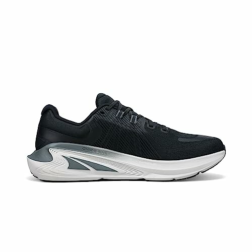 Black running shoe with white sole