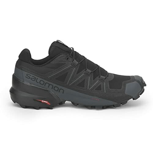 Black Salomon trail running shoe with rugged sole.