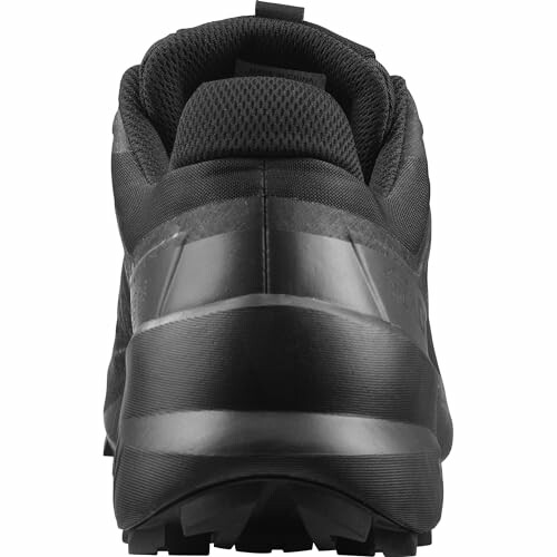 Rear view of a black sneaker with textured sole