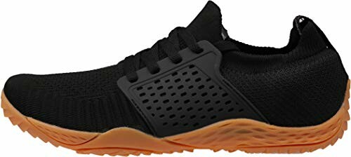 Black athletic shoe with orange sole