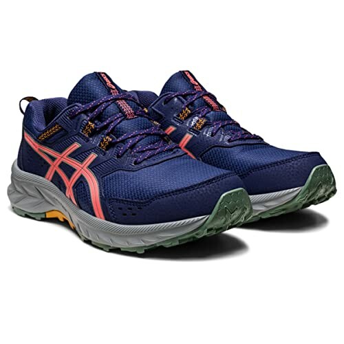 Pair of blue trail running shoes with orange accents