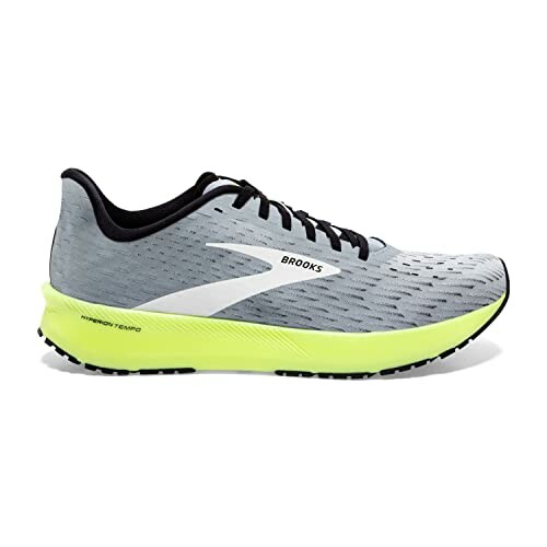 Side view of a gray and neon yellow Brooks running shoe.