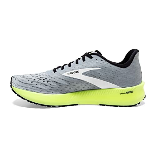 Side view of a Brooks running shoe with gray upper and neon yellow sole