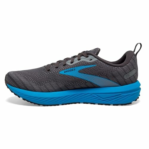 Gray and blue Brooks running shoe, side view.