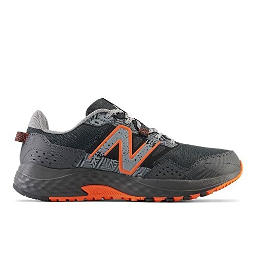 Gray and orange running shoe with textured sole.