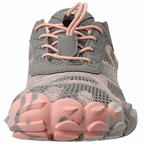 Front view of a gray and pink running shoe with unique sole design.