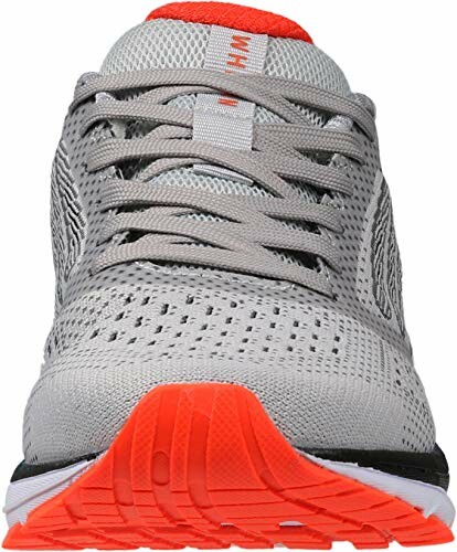 Front view of gray running shoe with orange sole