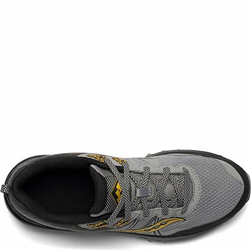 Top view of a gray running shoe with yellow accents.