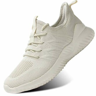 Lightweight beige sneaker with knit design and textured sole.