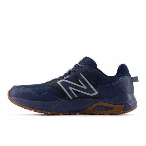 Navy running shoe with brown sole