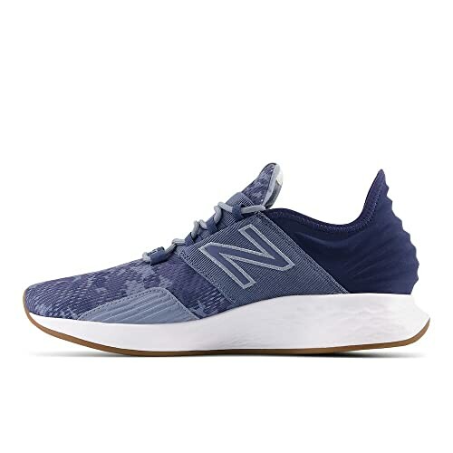 Blue New Balance running shoe side view