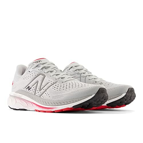 Gray New Balance running shoes with red accents