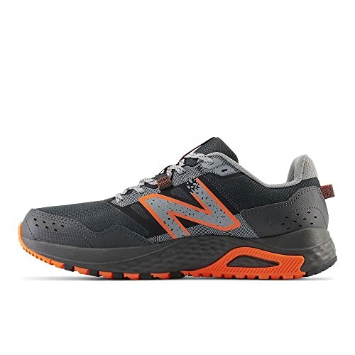 Gray and orange New Balance trail running shoe side view