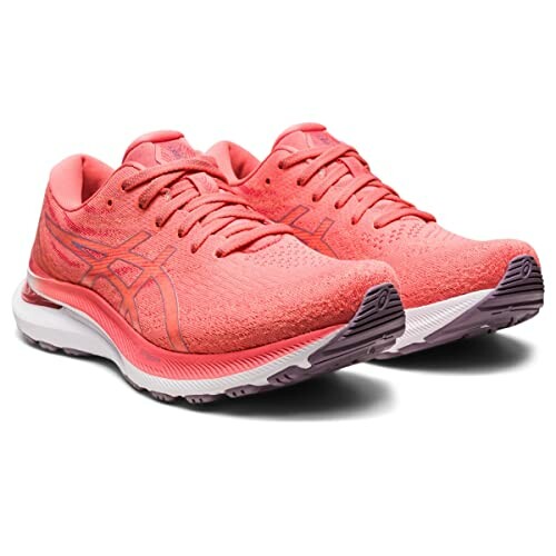 Pair of pink running shoes with white soles