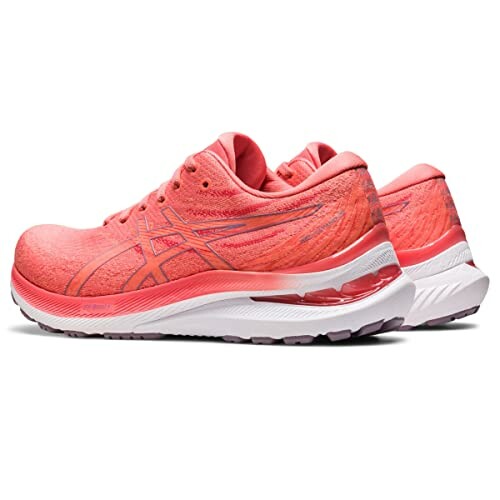 Pair of pink running shoes with cushioned soles.