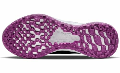 Purple sole of a running shoe