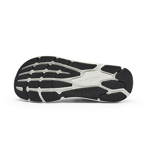 Black and white running shoe sole with textured grip