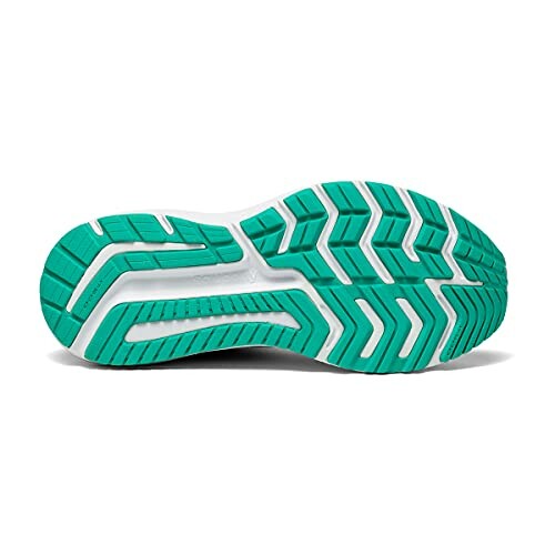 Green and white running shoe sole with tread pattern