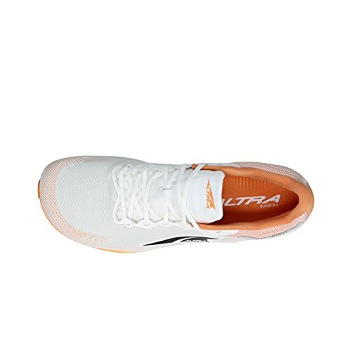 Top view of a white running shoe with orange interior accents.