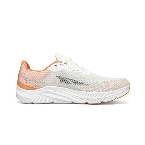 White and orange running shoe side view