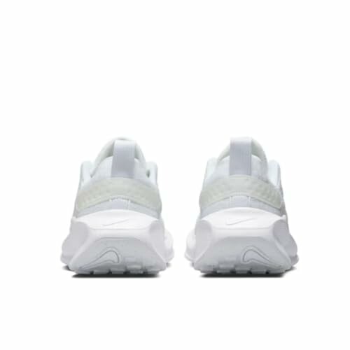 Back view of white sneakers with a minimalist design.