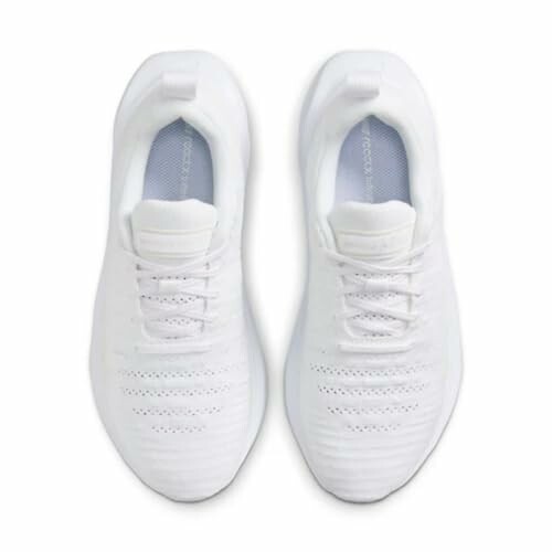 Top view of white sneakers with laces