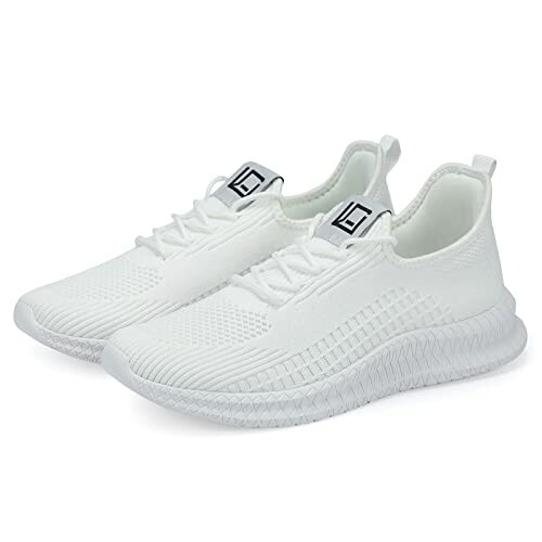 Pair of white sneakers with textured soles